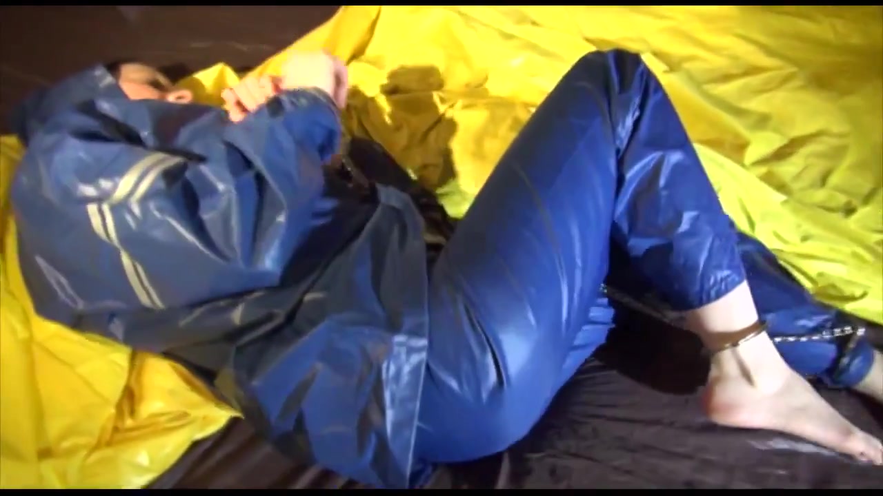 Get 2 Videos With Lucy Bound And Gagged In Her Shiny Nylon Rainwear From Our Archives