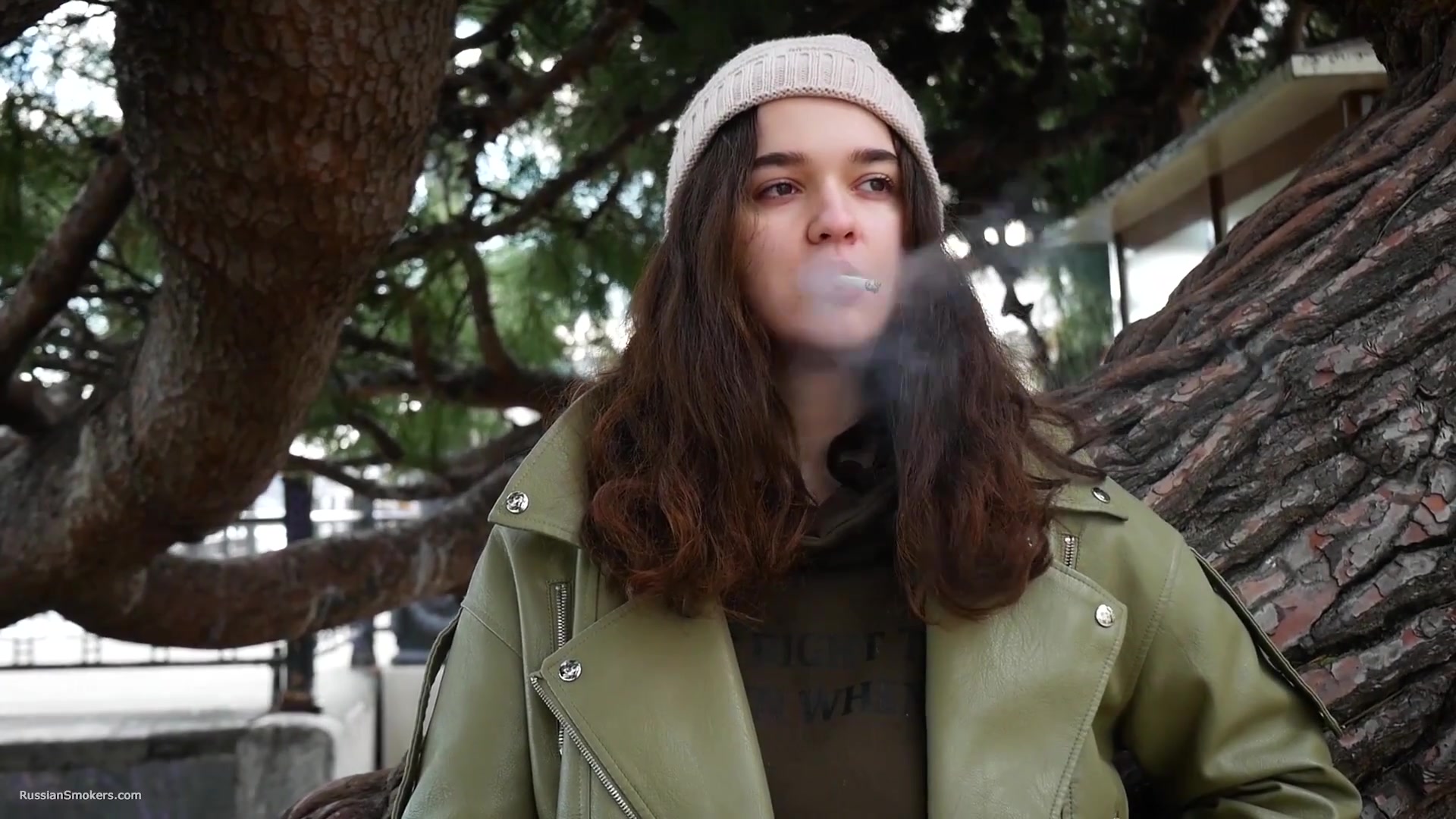 Young Brunette Is Taking An Unhurried Stroll With Allwhite 120mm Cigarette