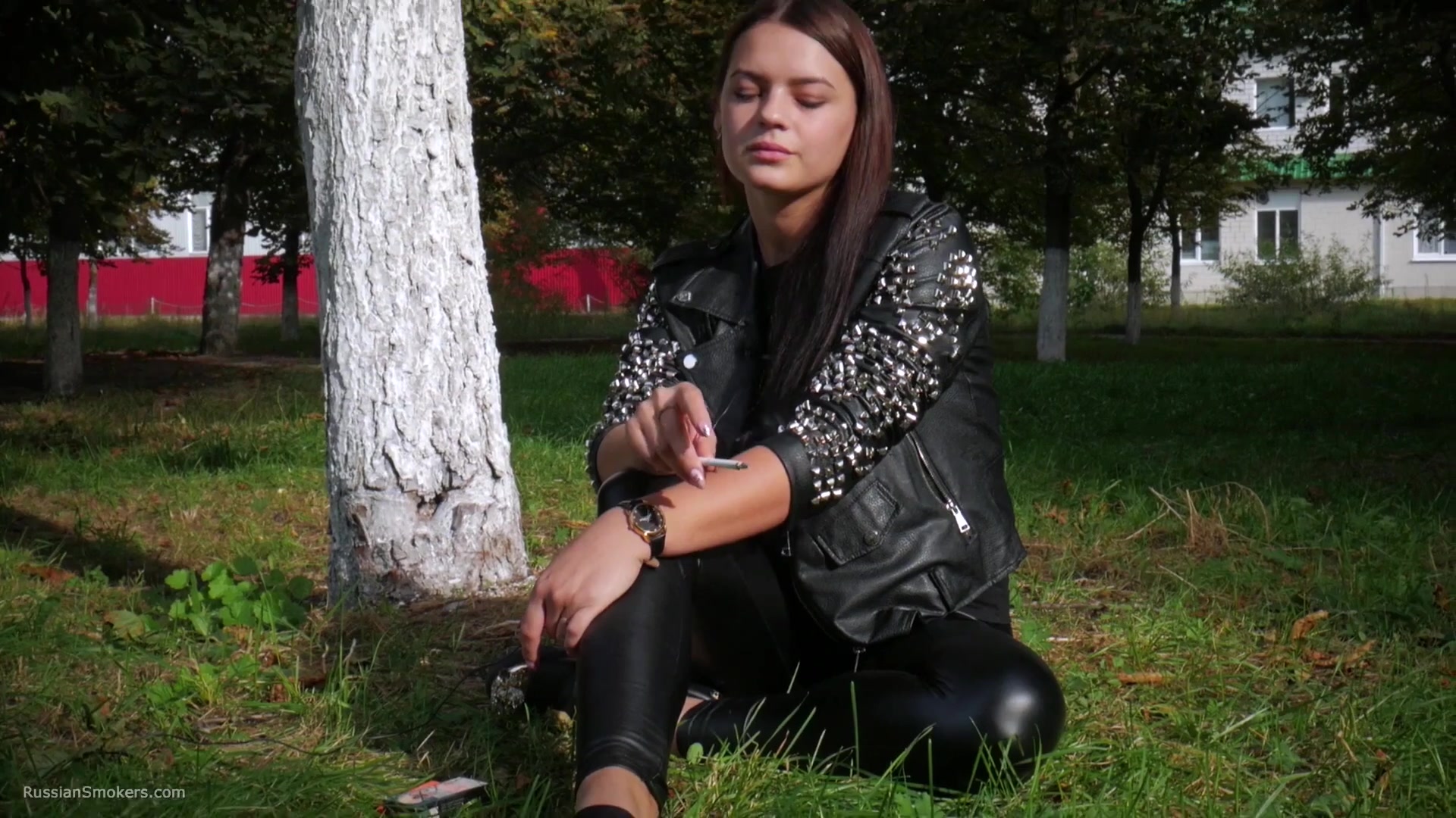 Pretty Faced Asya Is Smoking A Cigarette Outdoors