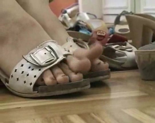 Lovely woman trys on different shoes in the foot fetish vid