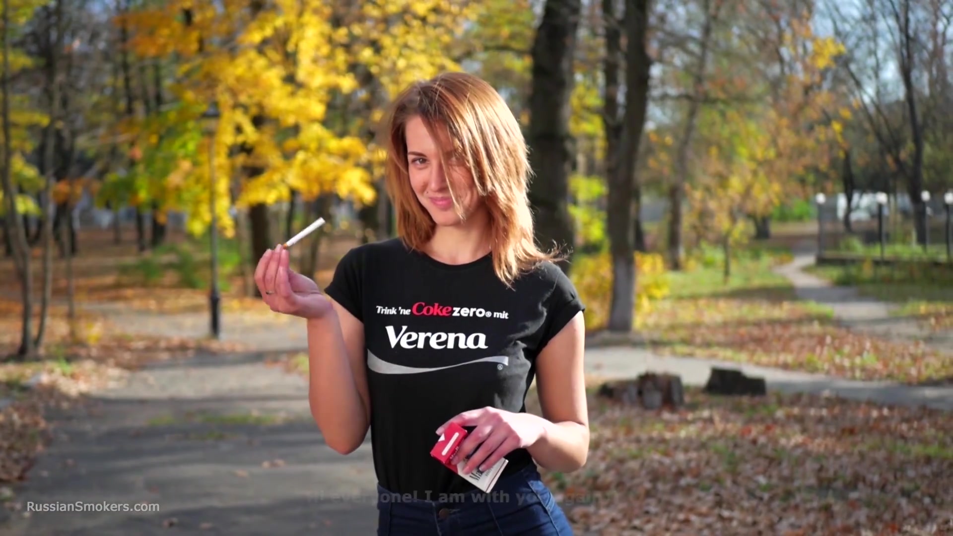 Sasha Is Smoking Two Cigarettes One By One In The Autumn Park