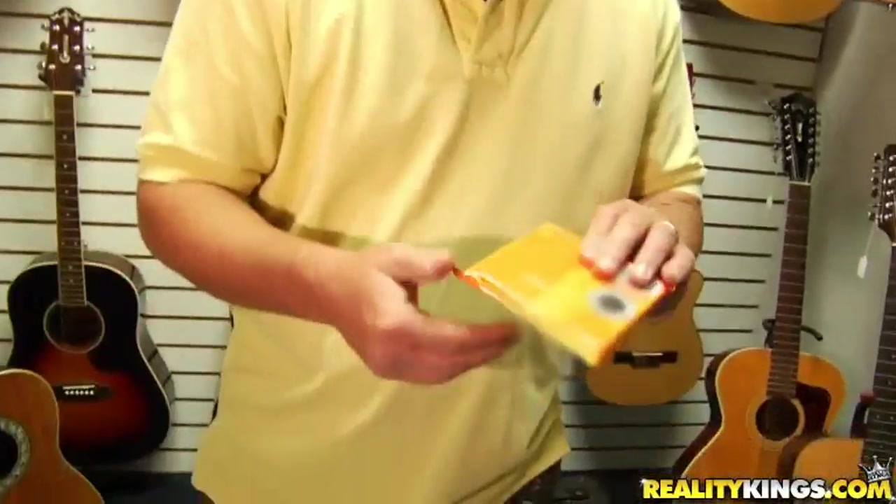 Dark haired chick is fucked in a musical shop