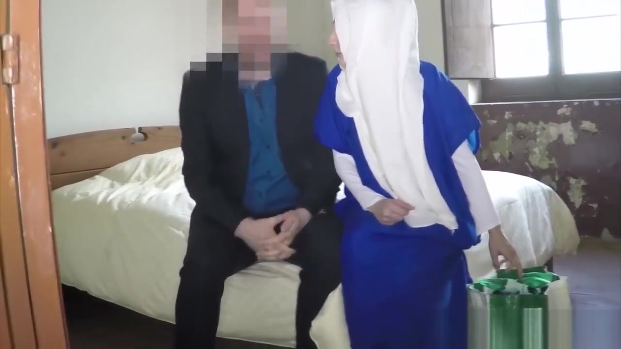 Hijab wearing babe sucking cock and balls