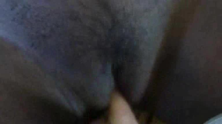 Black skinned girl has something inside her pussy