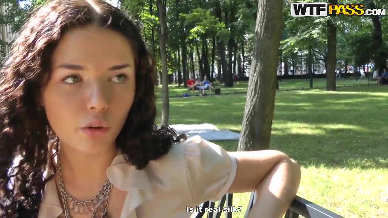 Cute curly brunette Leonora shows her boobs in park