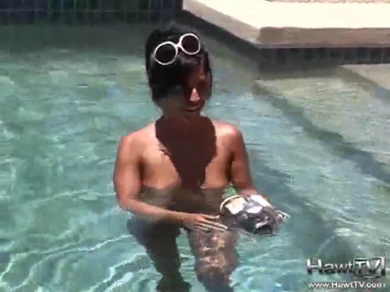 Babe on lilo naked in the sun