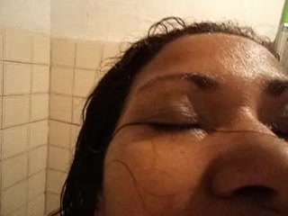 Hot slut giving blowjob under shower