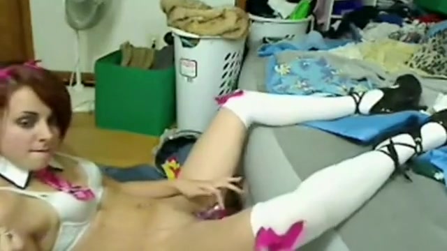 Cute girl spreading her legs and stuffs her pussy with a sex toy