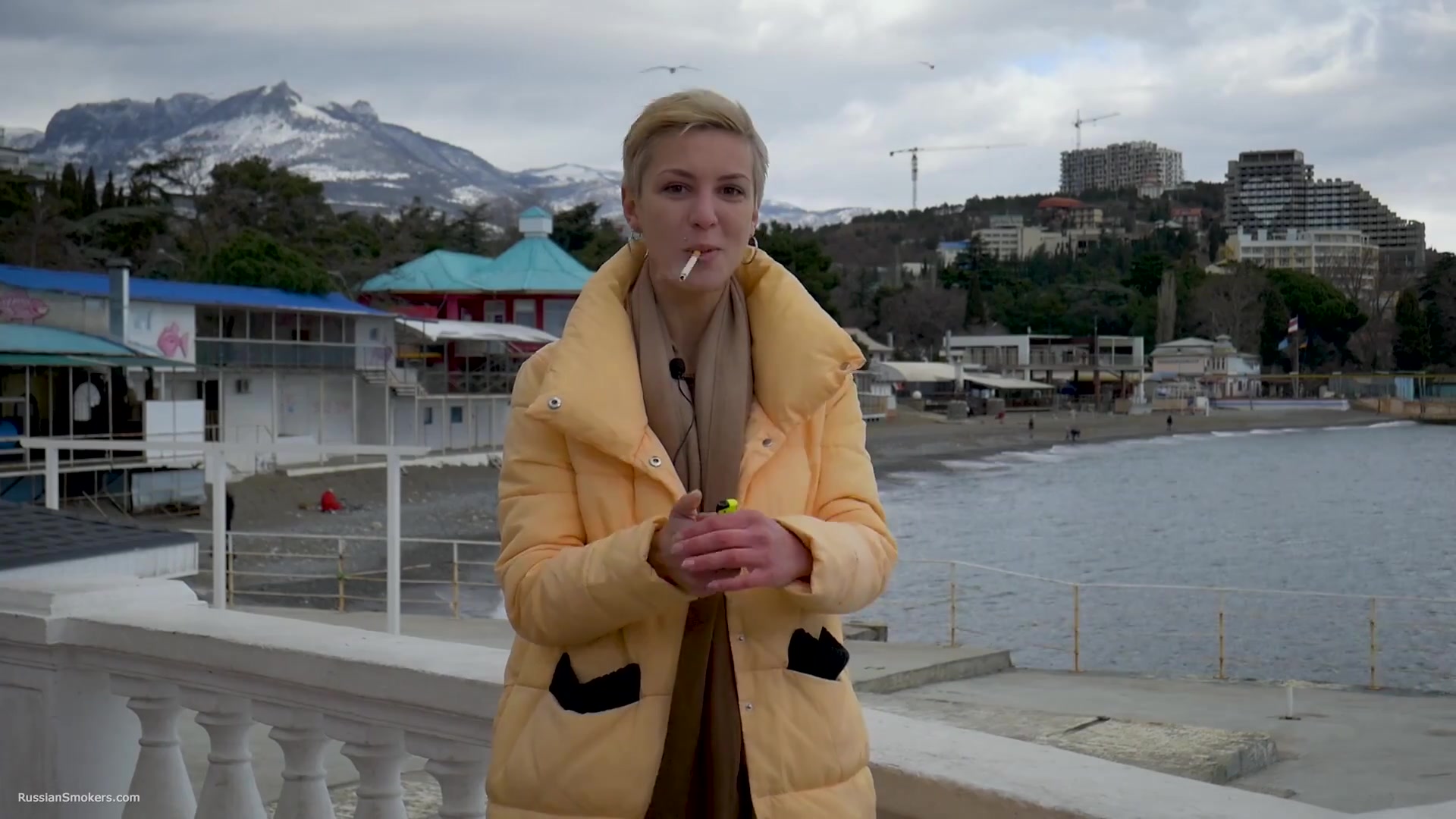 Short Cut Hair Blonde Girl Is Smoking Two Cork Cigarettes
