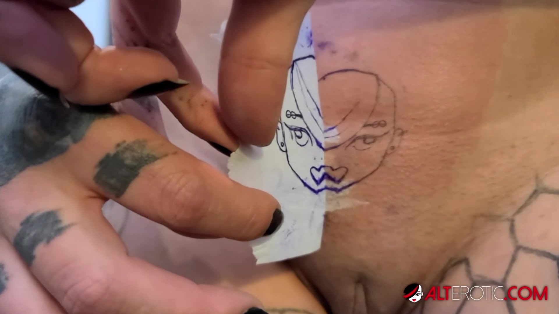 Nayomi Sharp Tattooing herself AltErotic Logo - AltErotic