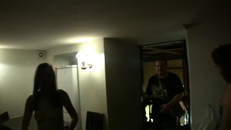Chick sucks and jerks two cocks at once