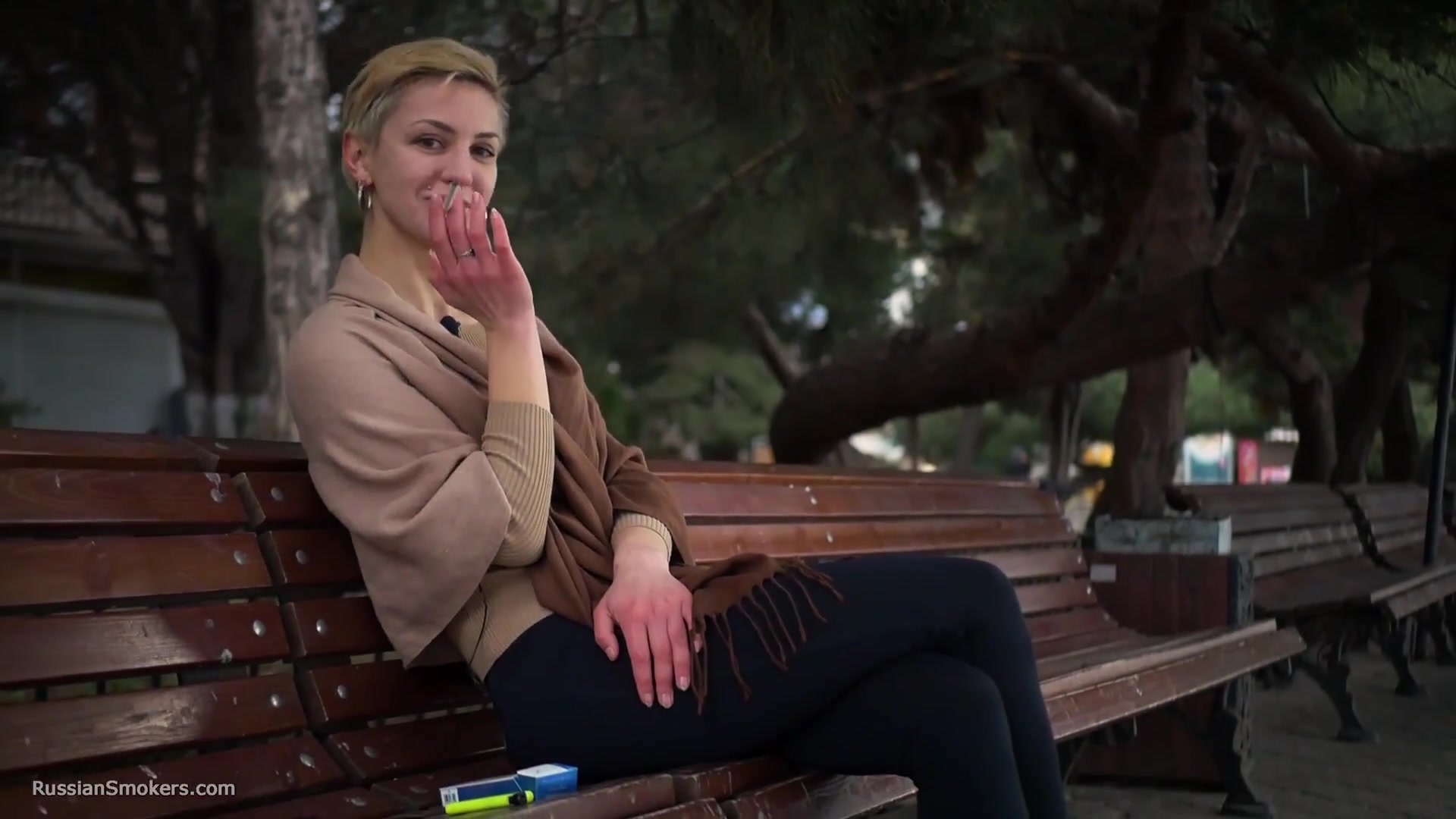 Short Cut Hair Blonde Girl Is Smoking All White 120mm Cigarettes
