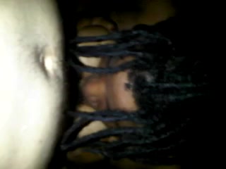 Darksome slut giving head while embracing my dick with her tits
