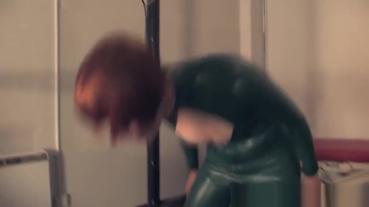 Trampling redhead dominatrix in latex