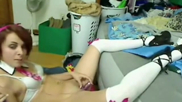Cute girl spreading her legs and stuffs her pussy with a sex toy