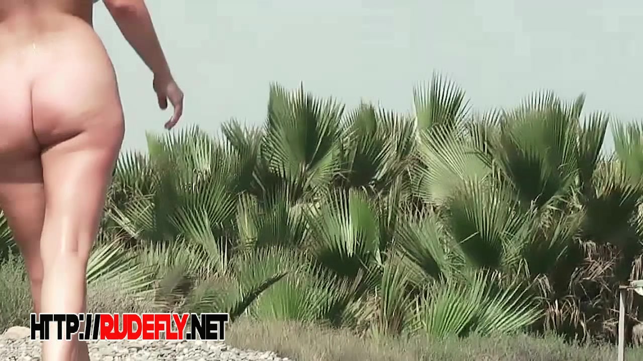 Tiny cutie caught on a nudist beach cam