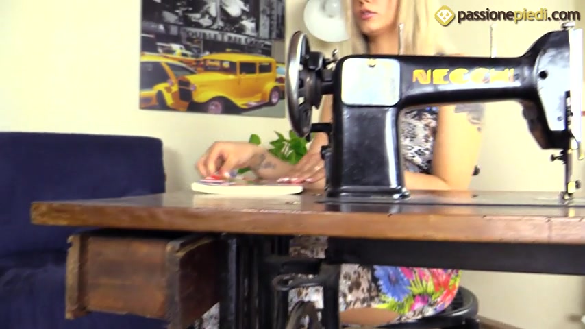 Bare feet Samantha sitting in a Necchi sewing machine