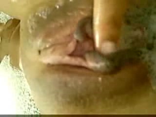 Sexy Latina soaps and caresses her shaved pussy