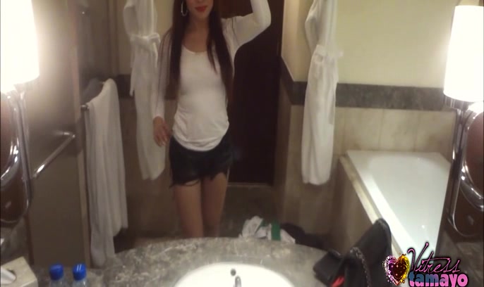 A Slut Tranny bends over and spreads her ass cheeks