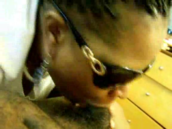 Black slut with sunglasses takes cock deep in her mouth