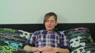 Guy touches him self on his bed