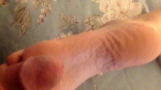 Wife giving footjob