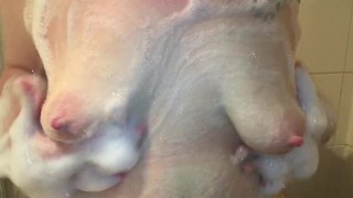 Playing with soapy boobs in the shower
