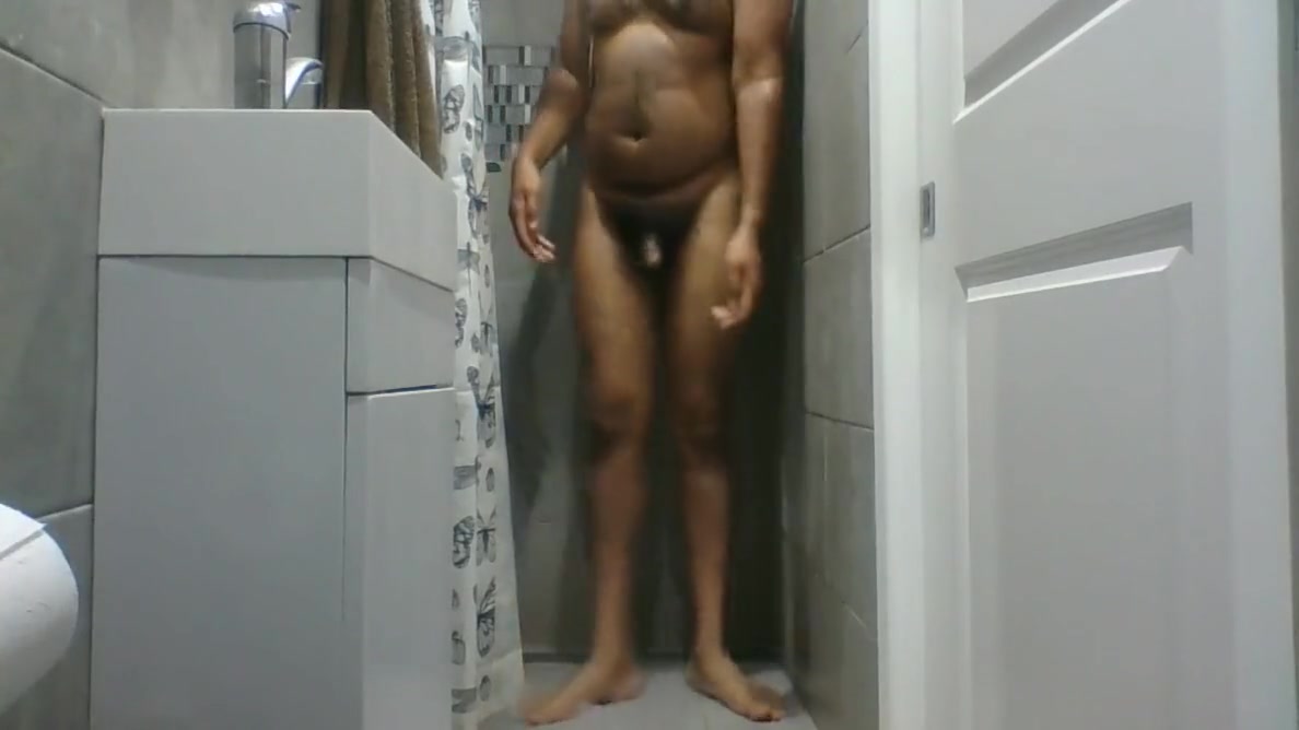 Indian Guy Enjoying Himself With An Oil Shower