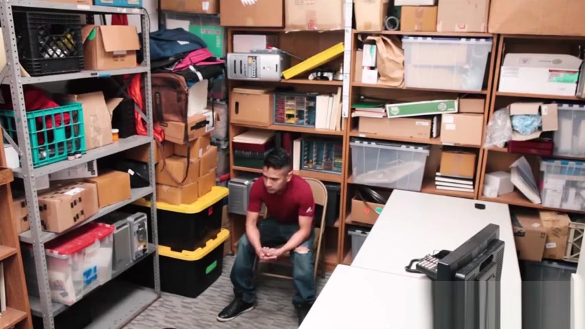 Loss Prevention officer kept an eye on the latino male