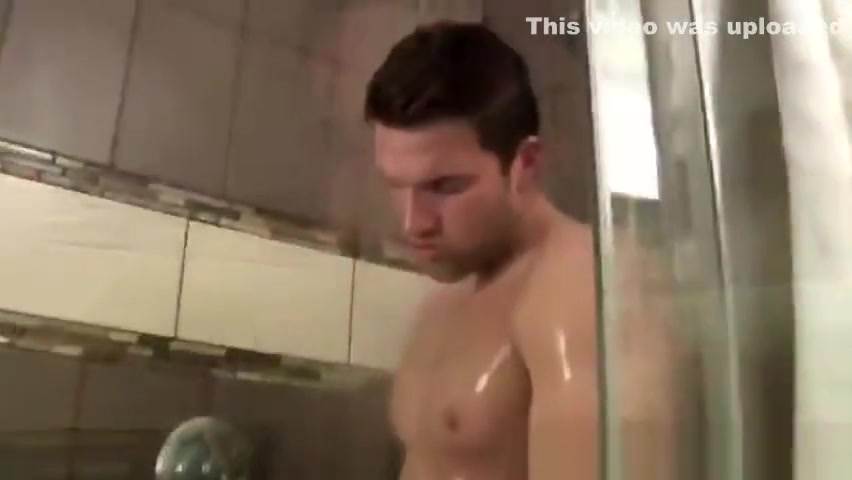 Gay jock has a hard feeling in the shower with a dick in his hands
