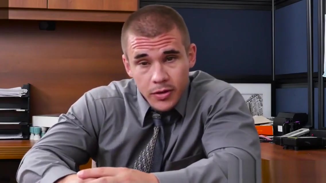 Muscular stud pounds bloke on office desk