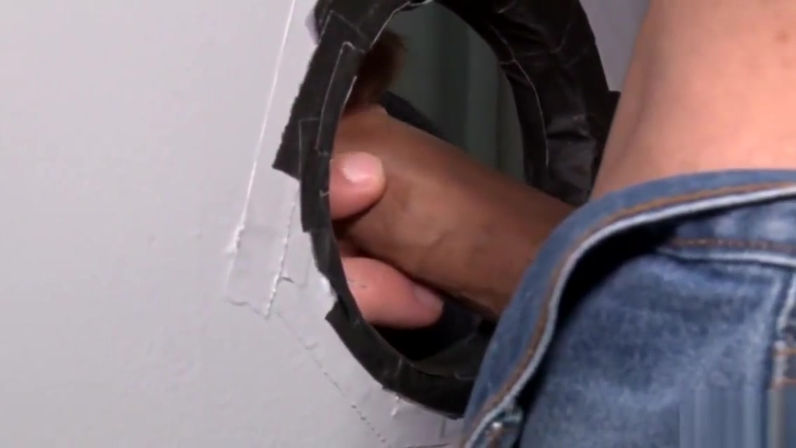 Two gays use a glory hole to hook up