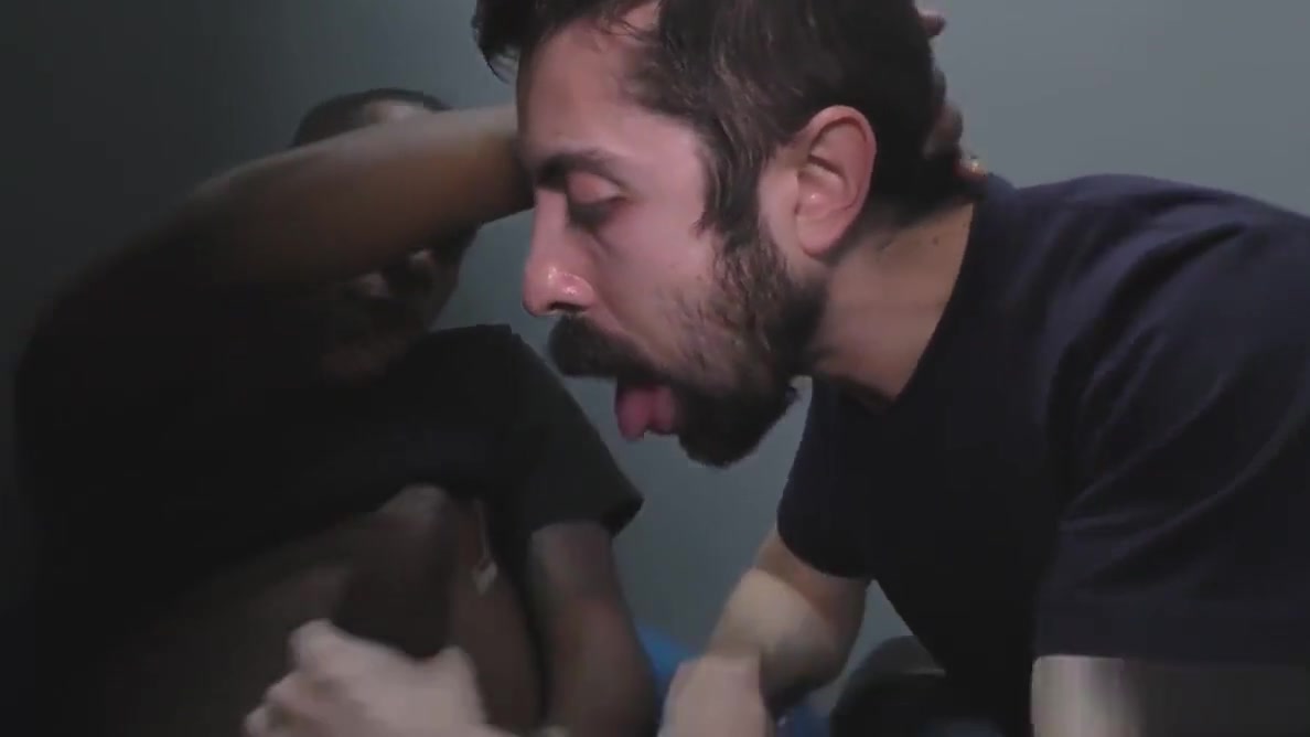 White man sucking and fucking a black cock at a gloryhole