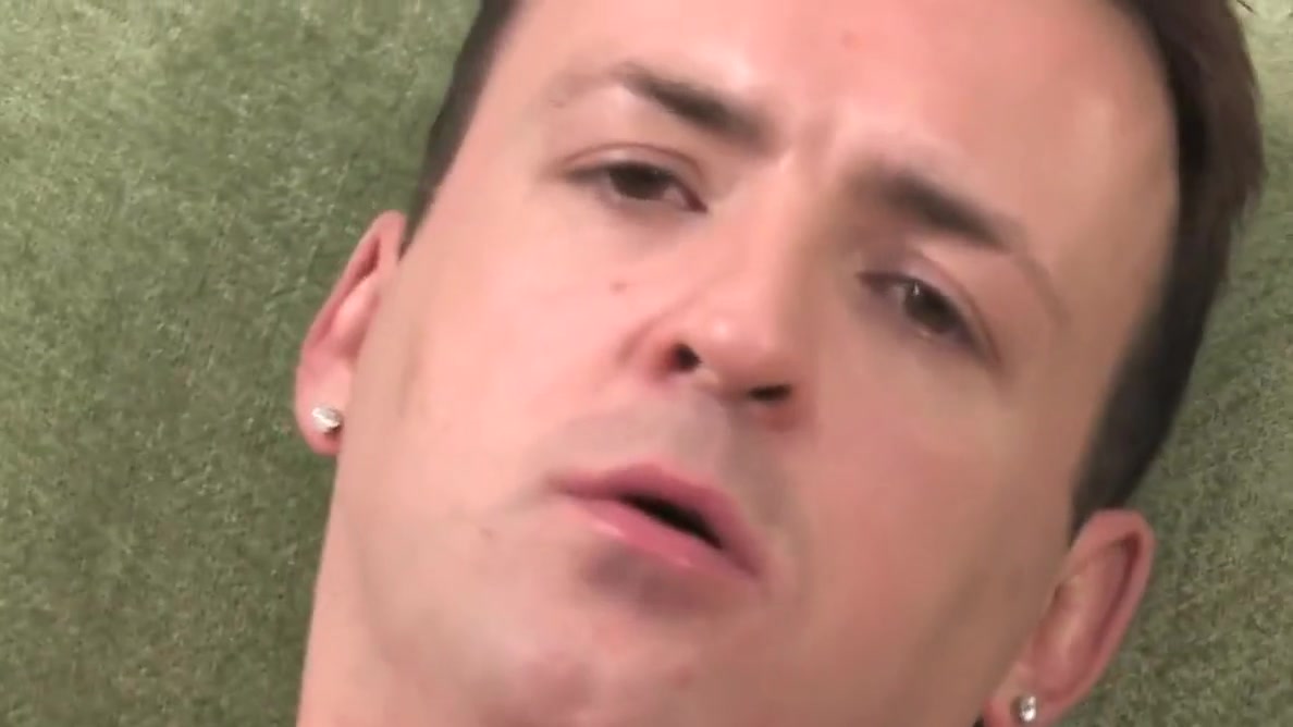 Brunette guy next door has a wank on a green sofa