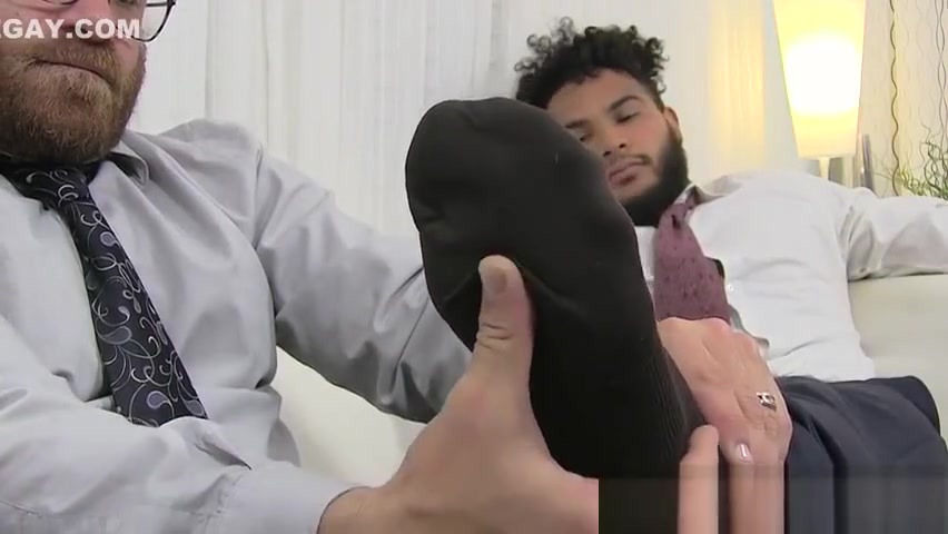 Latino hunk has his feet massaged and licked by bearded gay