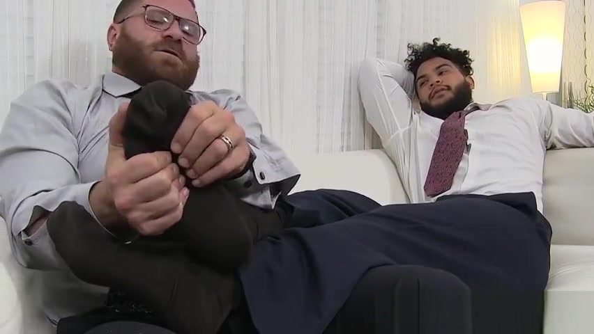 Latino hunk has his feet massaged and licked by bearded gay
