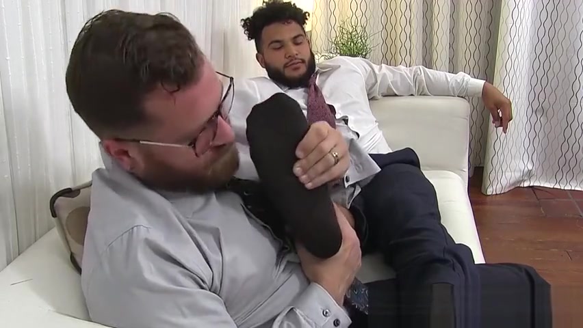 Latino hunk has his feet massaged and licked by bearded gay