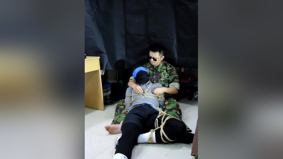 Military man gags boy with his sock