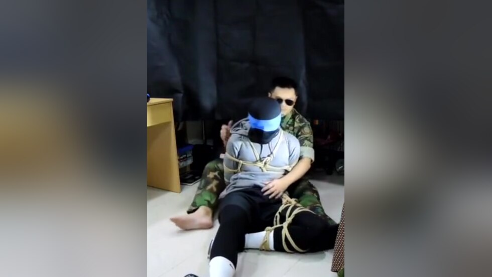 Military man gags boy with his sock