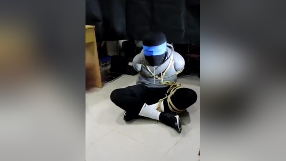 Military man gags boy with his sock
