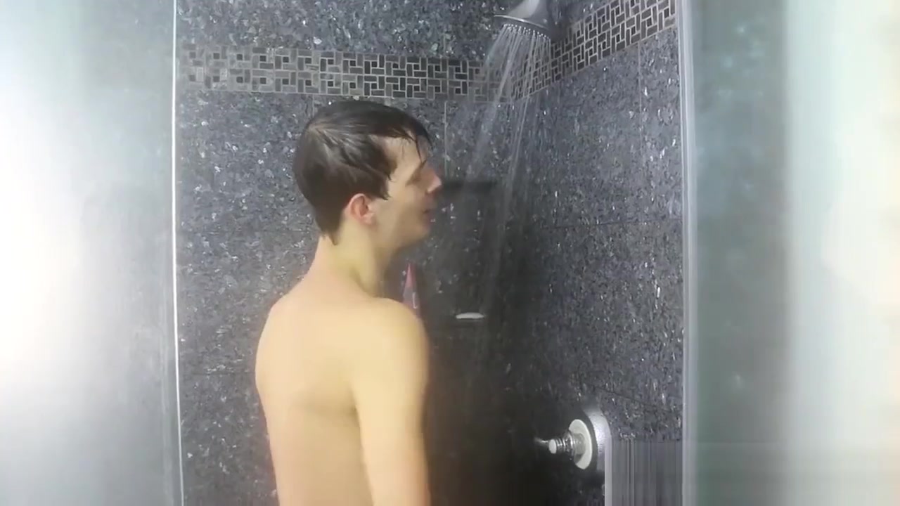 Nasty cock sucker Jasper Robinson wanks in the shower solo