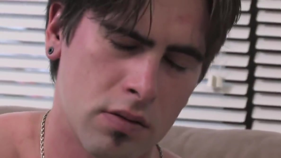 Tattoed Troy massages his cock erect alone for pleasure