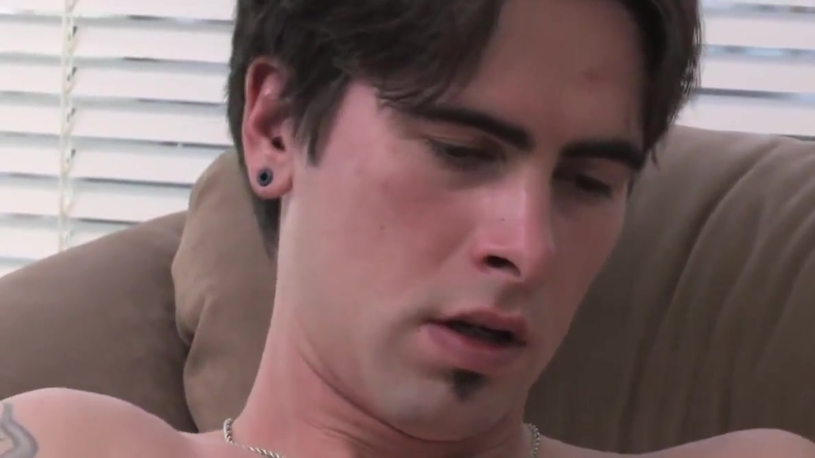 Tattoed Troy massages his cock erect alone for pleasure
