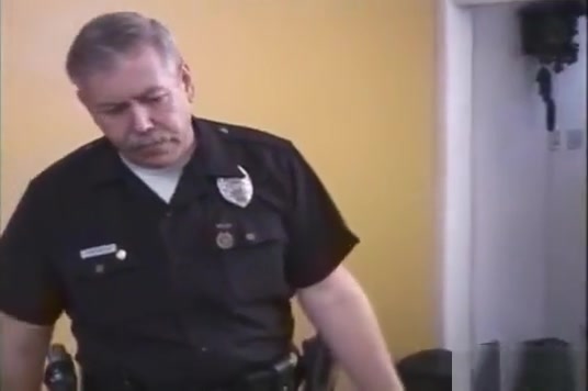 Police officer spanks two naughty boys