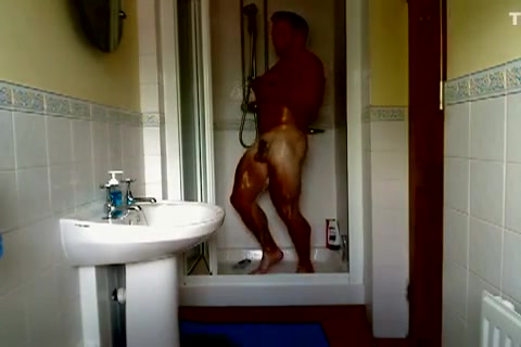 Bodybuilder showing off shower naked