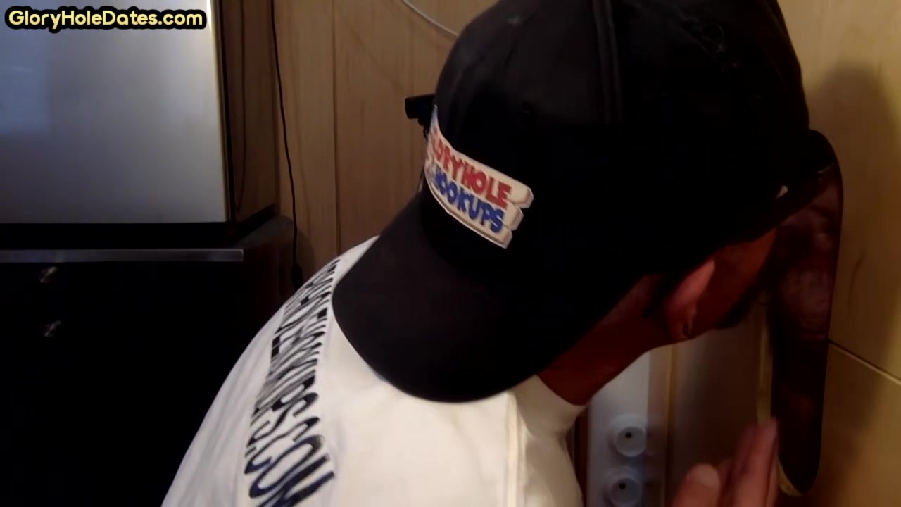 Homemade DILF sucks ands wanks penis through gloryhole