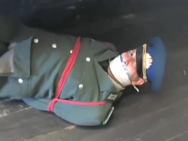 BG Military officer trussed up and gagged.