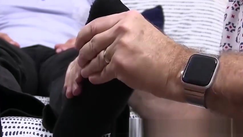 Hunky dude receives a skillful foot massage from his friend