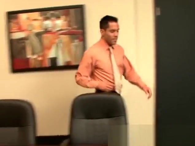 Two hunks making out in the office