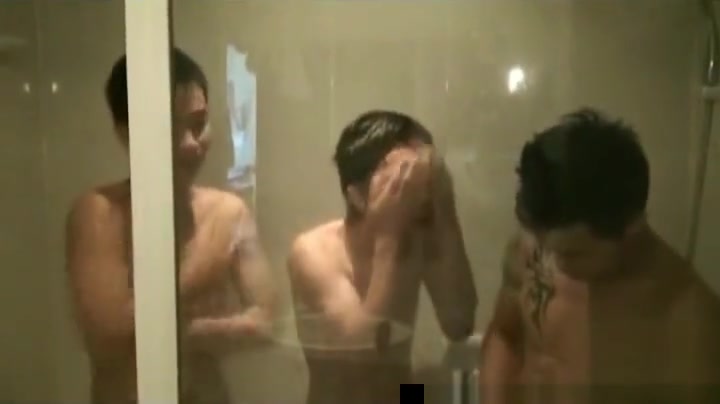 Asian guys having fun under shower